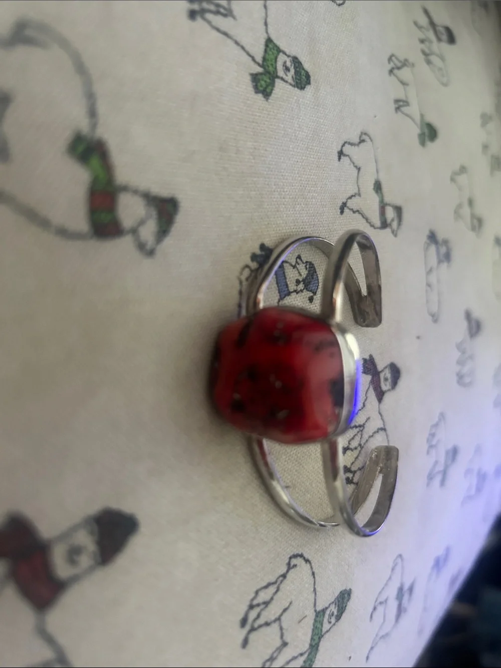 Silver bracelet with rough coral stone.